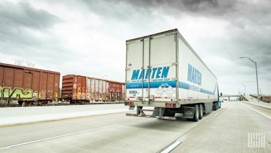 A Marten trailer near a train