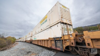 Double-stacked JB Hunt intermodal containers on well cars