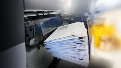 Letters piled up in a sorting machine.