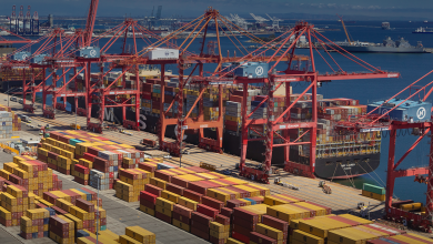 Image shows ships, cranes and containers at the Port of Long Beach, California.