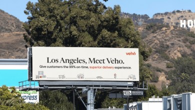 A billboard below the Hollywood hills in Los Angeles promotes Veho, a parcel delivery company.