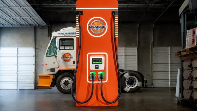 Orange Juicer battery-integrated DC fast charger by Orange EV and OptiGrid, optimizing grid for fleet electrification at IANA Intermodal EXPO 2025.