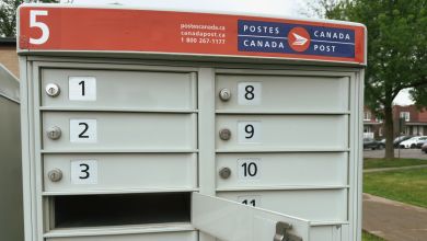 A Canada Post multi-user postal box, close view.