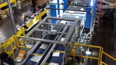 High-tech conveyor belt for packages at a USPS facility.
