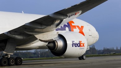 A close up view from under the wing of a FedEx jet.