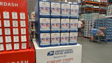 A display of USPS Forever Stamps at a Costco store.