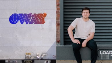 Oway logo in colorful gradient on a gray truck trailer beside founder Phillip Nadjafov sitting casually on a loading dock with a garage door background.