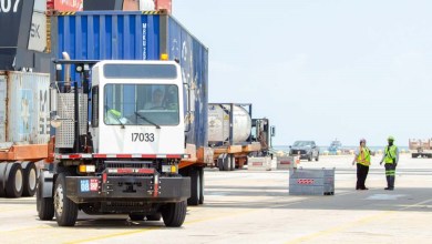 a terminal truck pulling a container at the Port of Houston