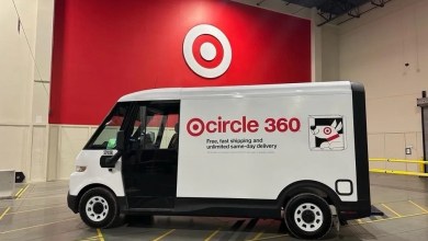 A Target delivery van is parked in front of a Target loading dock with red Target logo.