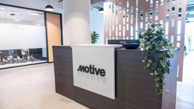 Motive reception desk with company logo in modern Austin office interior, highlighting AI technology platform's Texas expansion.