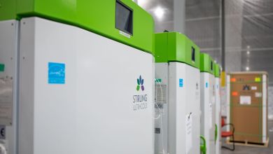 Giant freezers for pharmaceuticals with lime green lids.