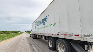 A Lineage trailer being pulled on a highway
