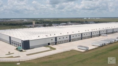 An image of a near empty warehouse with very few trucks or trailers, highlighting the challenge of falling freight volumes and fewer trucks according to a recent Q3 U.S. Bank Freight Index report