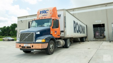 A YRC tractor with a Roadway trailer at a warehouse