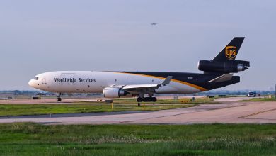 A brown-tailed UPS freighter is seen taxiing on a runway.