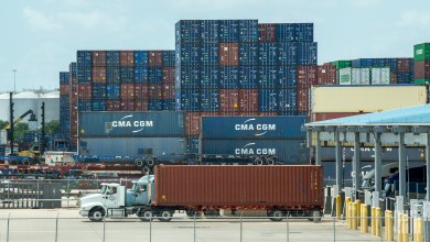 Trucks leaving port with containers