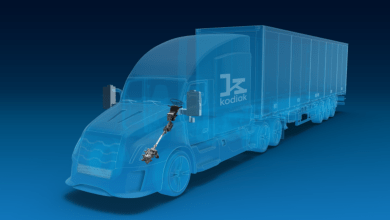 Rendering of a semi-transparent Kodiak AI autonomous semi-truck highlighting the ZF redundant steering actuator on a blue background.