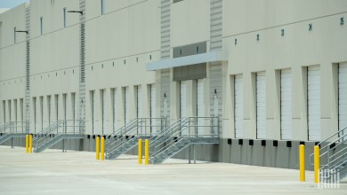 a warehouse with closed dock doors and no trucks