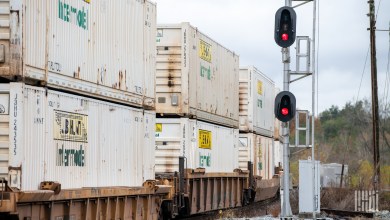 Double-stacked JB Hunt intermodal containers on well cars