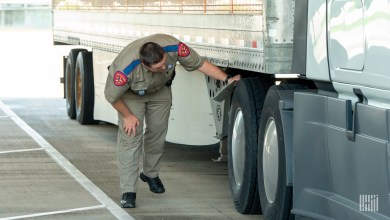 Officer inspecting truck tires