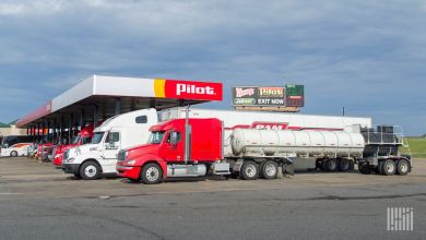 Trucks fueling at a truck stop. Side view.