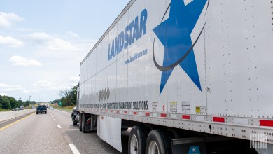 Sideview of a Landstar trailer on a highway