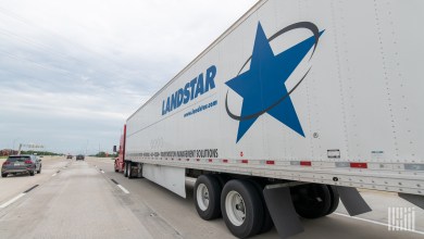 A Landstar trailer on a highway