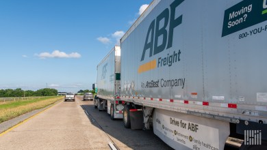a pair of ABF trailers being pulled on a highway