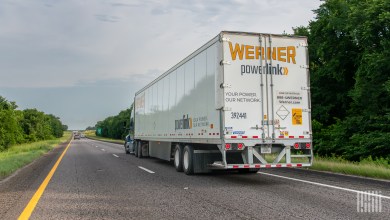 a rearview of a Werner trailer on a highway