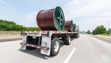 a loaded flatbed trailer on a highway