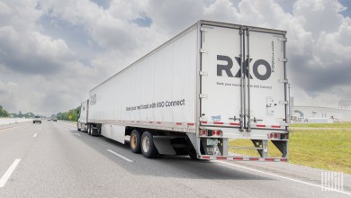 a white RXO trailer on a highway