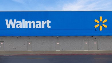 Blue facade with the Walmart logo on a building.