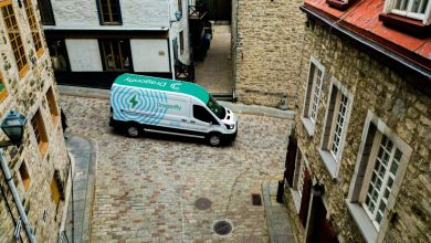 Dragonfly electric delivery van parked on a historic cobblestone street in Old Montreal, Canada – showcasing the company’s last-mile delivery network