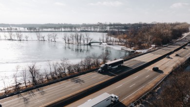 Torc Robotics autonomous truck on a snowy Michigan highway next to a frozen lake during winter testing