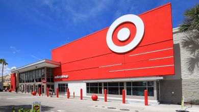 Bright red facade and logo on the front of a Target store, seen on a sunny day.