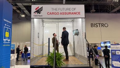 Wabash TrailerHawk cargo assurance solution display at Manifest 2026 featuring a transparent trailer mockup and attendees.