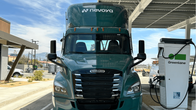 Nevoya electric Freightliner semi-truck charging at a Greenlane EV station