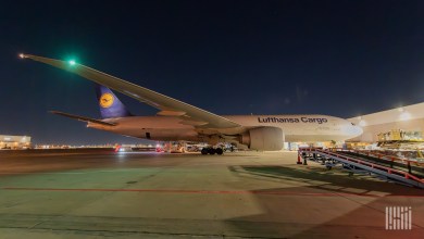 Night view of a Lufthansa Cargo jet on the airport tarmac.