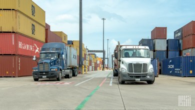 trucks with ocean containers at a port