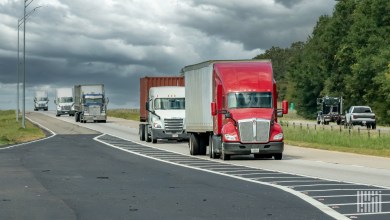 a line of tractor-trailers on a highway