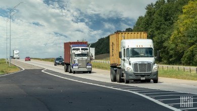 tractors pulling containers and trailers on a highway