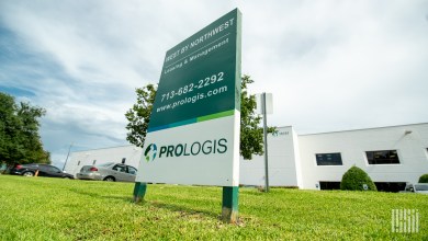 a Prologis sign in front of a warehouse