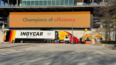 Shell Starship 3.0 natural gas truck at Indianapolis Motor Speedway with IndyCar trailer and Champions of efficiency banner during U.S. Eco-marathon.