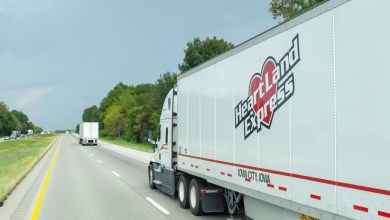 a white Heartland tractor-trailer on a highway