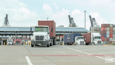 trucks with containers leaving a port