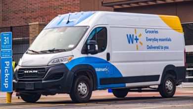 A Walmart delivery van with blue and yellow accents.