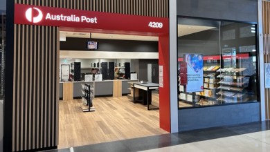 Front view of an Austrial Post retail store in a mall.
