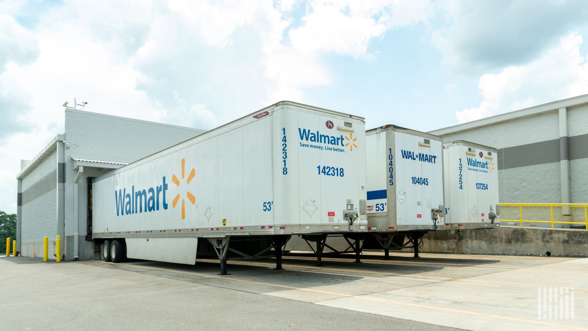 Walmart truck trailers seen at a loading dock.