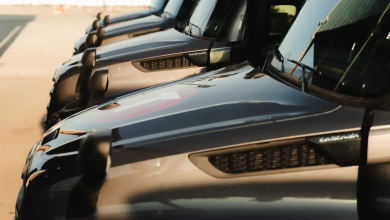 Row of Freightliner Cascadia trucks in Torc Robotics autonomous trucking fleet