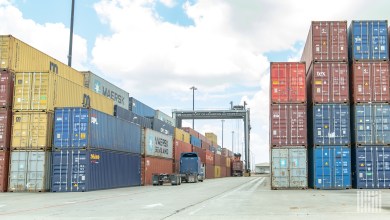 stacked ocean containers at a port